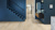 Wheat Oak LLP355 floors contrast with the dark blue hall and stairway walls