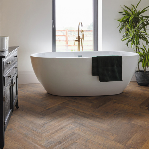 Karndean Antique French Oak herringbone wood flooring in a bathroom