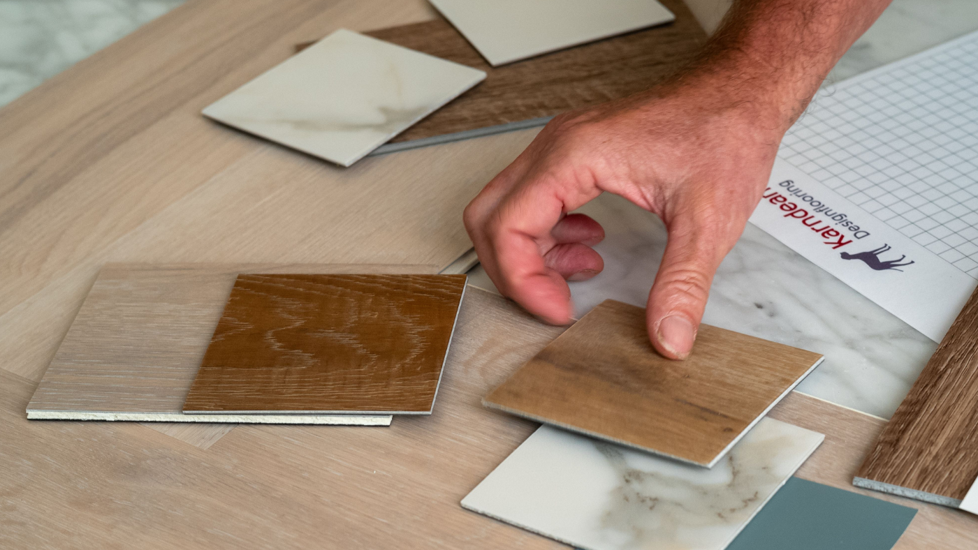 Variety of Karndean lvt floor samples spread on a counter