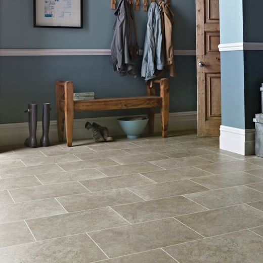 Portland Stone ST13 with DS10 design strips in a mudroom entry hallway Knight Tile