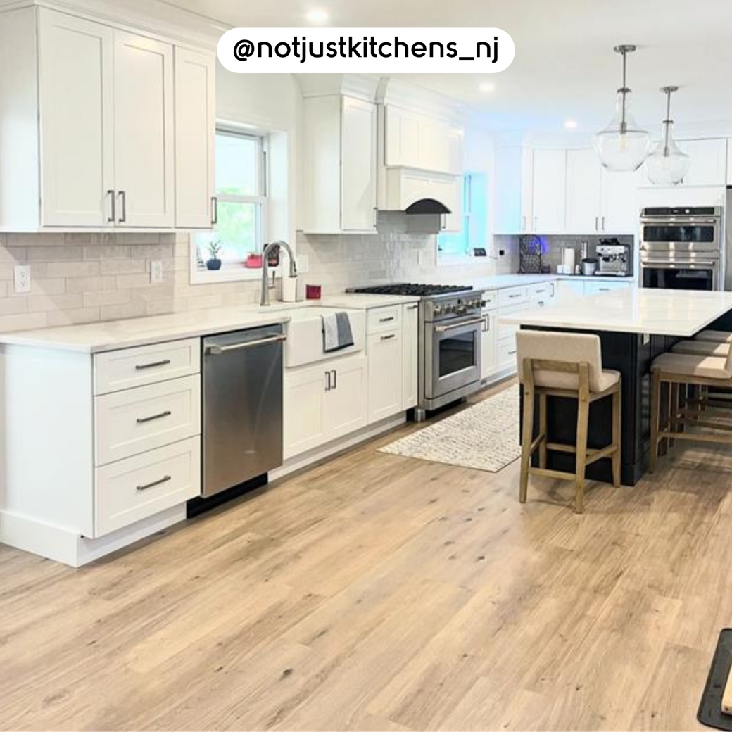 Canadian Urban Oak RKP8116 floors in a white kitchen; photo credit: @notjustkitchens_nj